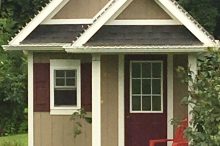 Charming Cottage-Style Shed with Gabled Roof and Porch