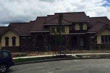 Mediterranean Style Custom Home Nearing Completion with Stucco and Stone Exterior