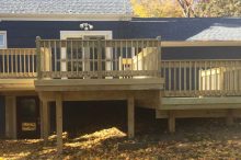 Multi-Tier Backyard Deck with Wood Railings