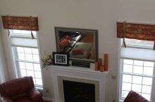 Bright Two-Story Family Room With Fireplace & Tall Windows